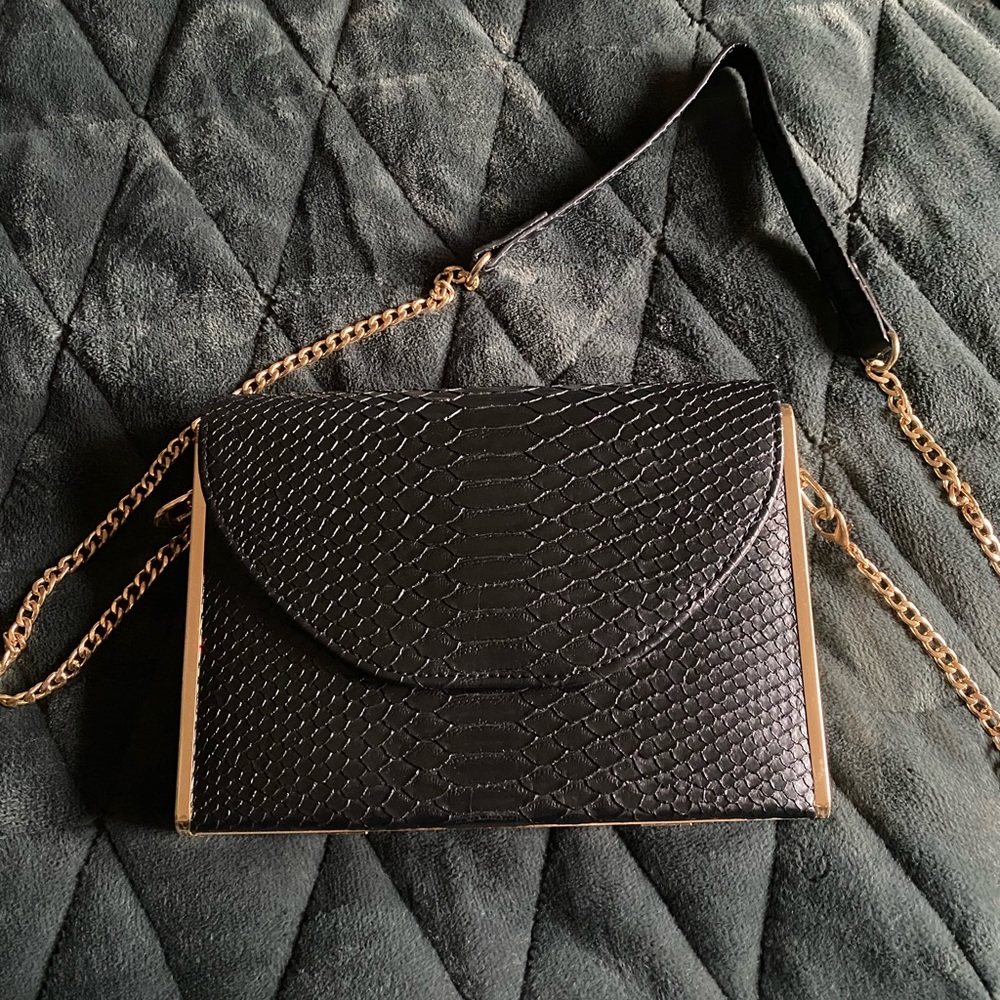 Madison west black crocodile skin purse with gold accents